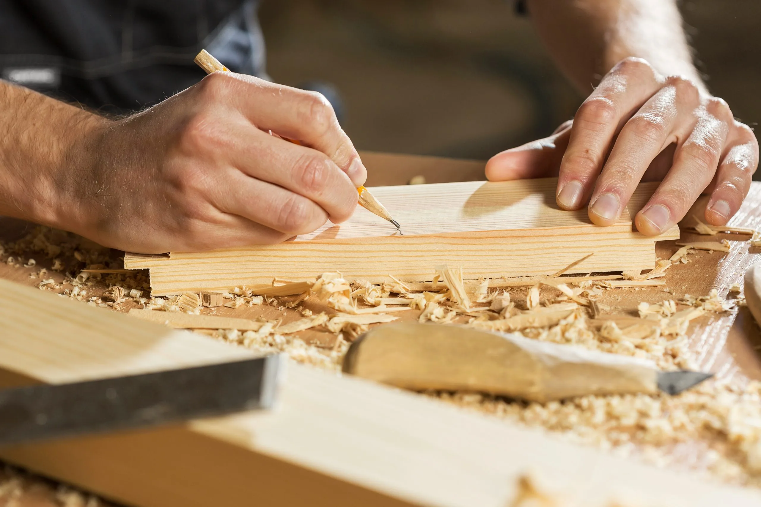 Person Cutting Wood - Photo by Craft Kitties on Unsplash